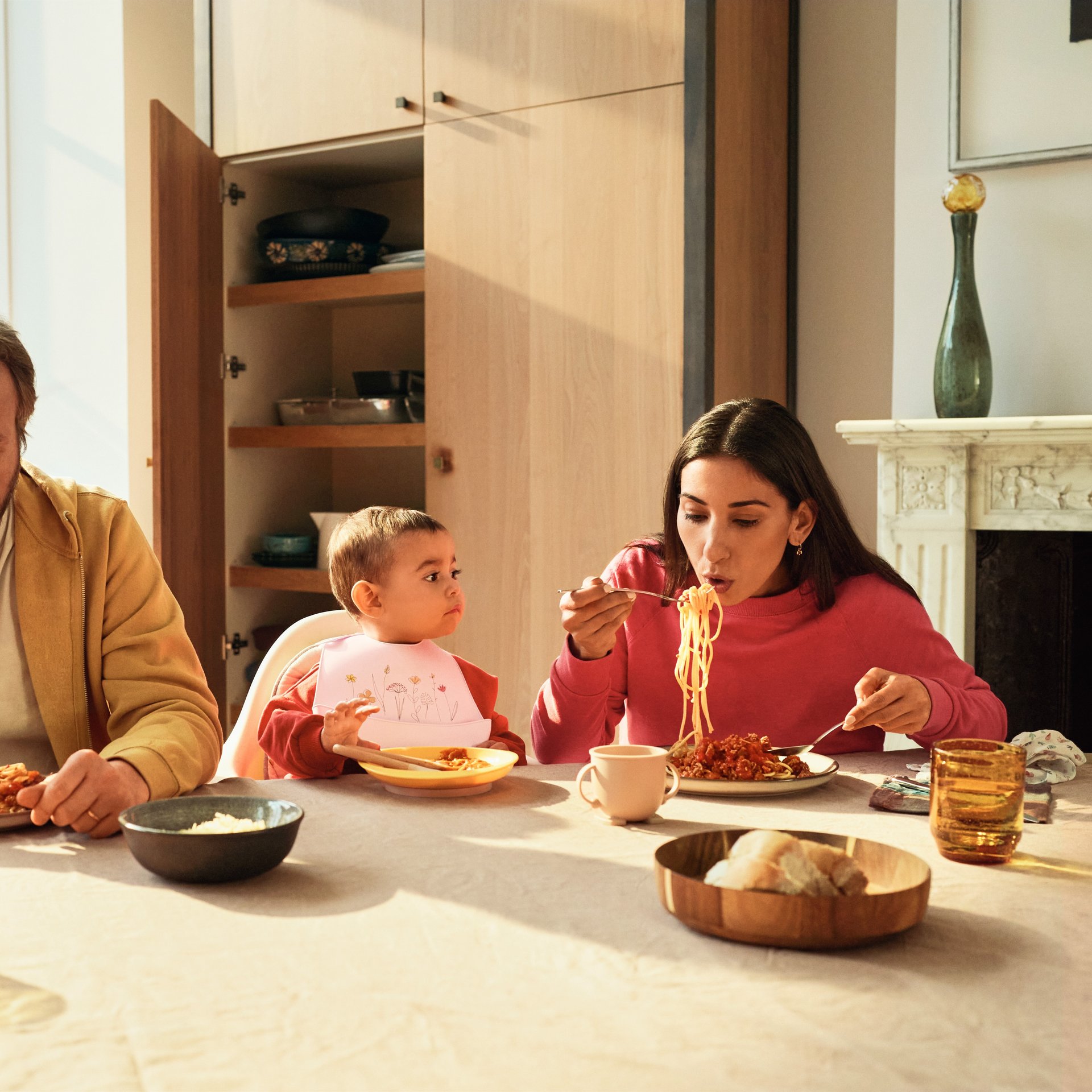 Giulia at the table with the grown ups